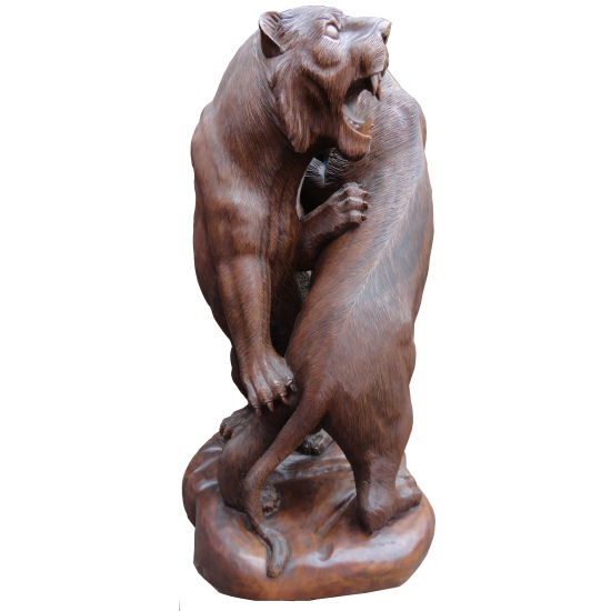 Indonesian Wood carvings hand carved sculpture of two lions fighting.