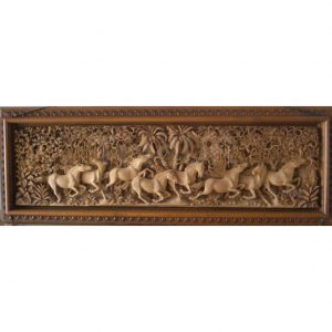 hand carved wooden horses in a 3D relief carvings by Indonesian artists